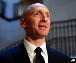In this Nov. 2, 2017, photo, Carter Page, a foreign policy adviser to Donald Trump, speaks with reporters following a day of questions from the House Intelligence Committee, on Capitol Hill in Washington.