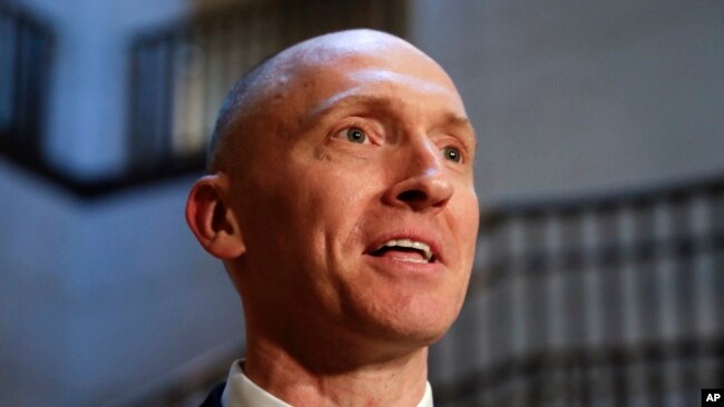 In this Nov. 2, 2017, photo, Carter Page, a foreign policy adviser to Donald Trump, speaks with reporters following a day of questions from the House Intelligence Committee, on Capitol Hill in Washington.