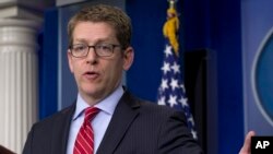 White House press secretary Jay Carney gestures as he speaks during the daily news briefing at the White House in Washington, April 15, 2014.