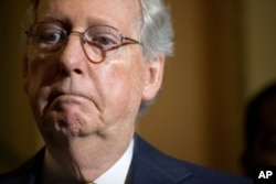 Senate Majority Leader Mitch McConnell speaks to the media during a news conference following a Senate policy luncheon on Capitol Hill in Washington, June 2, 2015.