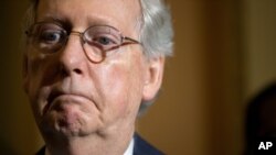 FILE - Senate Majority Leader Mitch McConnell speaks to the media during a news conference following a Senate policy luncheon on Capitol Hill.