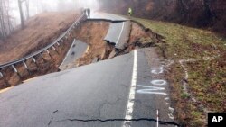 This image provided by the Tennessee Department of Transportation show damage to State Route 70 in Surgoinsville, Tenn., following a mudslide, Feb. 21, 2019. Elsewhere in Tennessee, Interstate 40 has been closed by a rockslide.