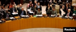 Members of the United Nations Security Council vote to tighten sanctions on North Korea in New York, Mar. 7, 2013.