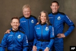 This undated photo made available by Blue Origin in October 2021 shows, from left, Chris Boshuizen, William Shatner, Audrey Powers and Glen de Vries. (Blue Origin via AP)