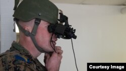 2nd Lt. Marko Vidovic, Armed Forces of Bosnia-Herzegovina, attaches a night vision device in preparation for the second weapons challenge in the Best Warrior Competition, March 15, 2018