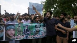 Students protest inside the Kashmir University campus in Srinagar, Indian-controlled Kashmir, July 8, 2018.
