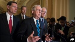 FILE - Senate Majority Leader Mitch McConnell of Kentucky meets with reporters after a closed-door Republican strategy session, Tuesday, July 11, 2017, on Capitol Hill in Washington.