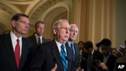 Senate Majority Leader Mitch McConnell of Kentucky, joined by, from left, Sen. John Barrasso, R-Wyo., Sen. John Thune, R-S.D., the Republican Conference chairman, and Senate Majority Whip John Cornyn of Texas, meets with reporters after a closed-door Repu