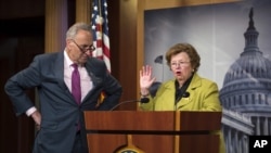FILE - Sen. Barbara Mikulski, who supports the Iran nuclear deal, and Sen. Charles Schumer, who opposes it, are seen during a news conference on Capitol Hill in Washington, June 9, 2015.