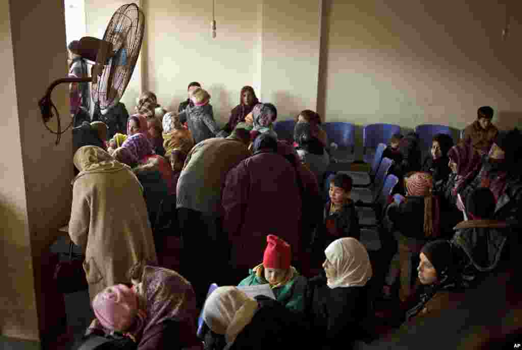 Syrians wait for their appointments at the U.N. refugee agency's registration center in Zahleh, in Lebanon's Bekaa Valley, Dec. 18, 2013.