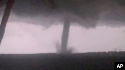 This Oct. 20, 2019 image made from video by Twitter user @AthenaRising shows the tornado in Rockwall, TX. 