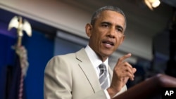 FILE - President Barack Obama speaks in the James Brady Press Briefing Room of the White House in Washington.