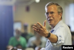 FILE - Republican presidential candidate Jeb Bush answers a question from the audience during a town hall campaign stop at the VFW Post in Hudson, New Hampshire, July 8, 2015.