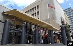 FILE - In this March 17, 2003 file photo, an Israeli border policemen guards the U.S. Embassy in Tel Aviv.