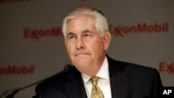 FILE - ExxonMobil CEO Rex Tillerson listens to a reporter's question after the annual meeting ExxonMobil shareholders meeting in Dallas, May 28, 2014.