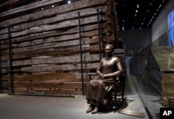 FILE - A statue of pioneer Clara Brown, who was born a slave in Virginia around 1800, is on display at the National Museum of African American History and Culture in Washington, Sept. 14, 2016.
