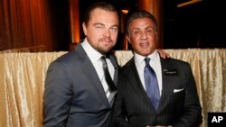 Leonardo DiCaprio, left, and Sylvester Stallone attend the 88th Academy Awards Nominees Luncheon at The Beverly Hilton hotel, Beverly Hills, California, Feb. 8, 2016.