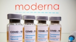 Vials with a sticker reading, "COVID-19 / Coronavirus vaccine / Injection only"