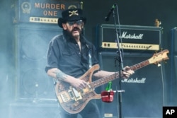 FILE - Lemmy Kilmister of Motörhead performs at THE Glastonbury Music Festival at Worthy Farm, Glastonbury, England, June 26, 2015.