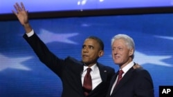 President Barack Obama waves as he joins Former President Bill Clinton during Democratic National Convention Sept. 5, 2012