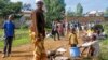 A refugee from the Democratic Republic of Congo is seen with her children near the United Nations High Commissioner for Refugees (UNHCR) offices in Kiziba refugee camp in Karongi District, Rwanda, Feb. 21, 2018.