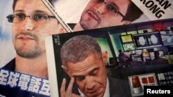 Photos of Edward Snowden, a contractor at the National Security Agency (NSA), and U.S. President Barack Obama are printed on the front pages of local English and Chinese newspapers in Hong Kong in this illustration photo June 11, 2013. Snowden, who leaked
