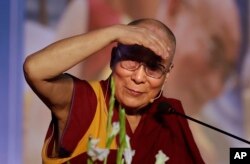 Tibetan spiritual leader, the Dalai Lama, speaks at the inauguration of the four-day seminar on legacy of Tibet, Nalanda tradition of Buddhism, in New Delhi, India, Dec. 9, 2016. He will also attend a summit seeking to end child labor.