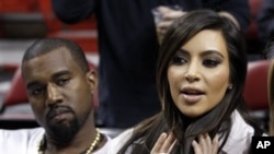 Kim Kardashian and Kanye West at an NBA basketball game last month