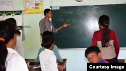 Oun Kosorl is seen teaching English to students at Mother Home Cambodia school. (Courtesy of Oun Kosorl)