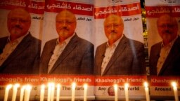 Candles, lit by activists, protesting the killing of Saudi journalist Jamal Khashoggi, are placed outside Saudi Arabia's consulate, in Istanbul, during a candlelight vigil, Oct. 25, 2018. 