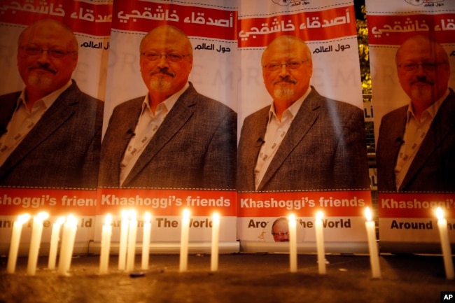 Candles, lit by activists, protesting the killing of Saudi journalist Jamal Khashoggi, are placed outside Saudi Arabia's consulate, in Istanbul, during a candlelight vigil, Oct. 25, 2018.