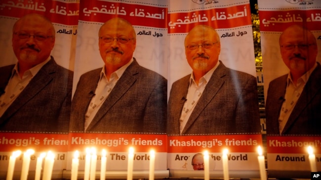 Candles, lit by activists, protesting the killing of Saudi journalist Jamal Khashoggi, are placed outside Saudi Arabia's consulate, in Istanbul, during a candlelight vigil, Oct. 25, 2018.