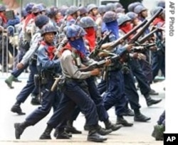 Burmese military address a protest in this file photo from 2007. The government continues to crack down on dissent, according to the U.S. Department of State.