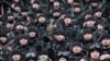 FILE - Chechen special forces listen to Chechnya's regional leader Ramzan Kadyrov (unseen) deliver a speech in Chechnya's capital of Grozny, Russia, Dec. 28, 2014.