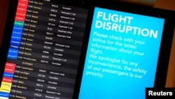 An arrivals board in the South Terminal building at Gatwick Airport, seen after the airport reopened briefly to flights following its forced closure because of drone activity, in Gatwick, Britain, Dec. 21, 2018. 