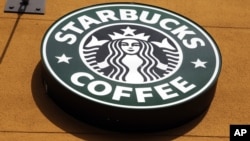 FILE - The Starbucks Coffee logo in Mountain View, California. The company announced in July it would be partnering with Taste Holdings to bring a number of stores to South Africa.