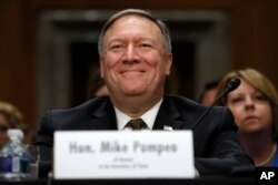 CIA Director Mike Pompeo, picked to be the next secretary of state, smiles after his introductions before the Senate Foreign Relations Committee during a confirmation hearing on his nomination to be secretary of state, April 12, 2018, on Capitol Hill in Washington.