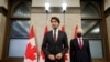 Canada's Prime Minister Justin Trudeau, accompanied by Foreign Minister Marc Garneau, holds a press conference as he tells reporters that two Canadian citizens who were detained by Beijing have left Chinese airspace, in Ottawa, Sept. 24, 2021.