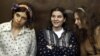 Nadezhda Tolokonnikova (L), Yekaterina Samutsevich (C) and Maria Alyokhina, members of female punk band 'Pussy Riot,' attend their trial in a court in Moscow, August 3, 2012.