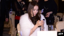 Guo Meimei attends a jewelry auction in Beijing, China, Dec. 1, 2013.