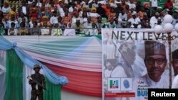 FILE - A soldier stands guard during a launch campaign by the ruling All Progressives Congress (APC) party for President Muhammadu Buhari's re-election bid, in Uyo, Nigeria, Dec. 28, 2018.