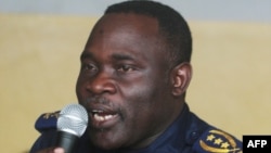 FILE - Former Kinshasa police chief, John Numbi, speaks while in court, Jan. 27, 2011. U.S. authorities are placing sanctions on Gabriel Amisi Kumba and John Numbi who are considered to be close to President Joseph Kabila.