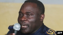 FILE - Former Kinshasa police chief, John Numbi, speaks while in court, Jan. 27, 2011.