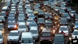 In this Sept. 24, 2010 photo, motorists are stuck in traffic jam during an evening rush hour at the main business district in Jakarta, Indonesia. (AP Photo/Tatan Syuflana)