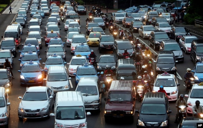 In this Sept. 24, 2010 photo, motorists are stuck in traffic jam during an evening rush hour at the main business district in Jakarta, Indonesia.