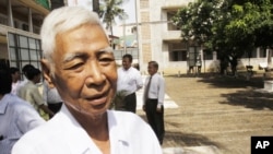 In this photo taken on Aug. 9, 2010, a Cambodian survivors, Vann Nath, 66, is seen at Tuol Sleng genocide museum, formerly Khmer Rouge's notorious S-21 prison in Phnom Penh, Cambodia. Nath lapsed into a coma in late August, 2011, after developing breathin