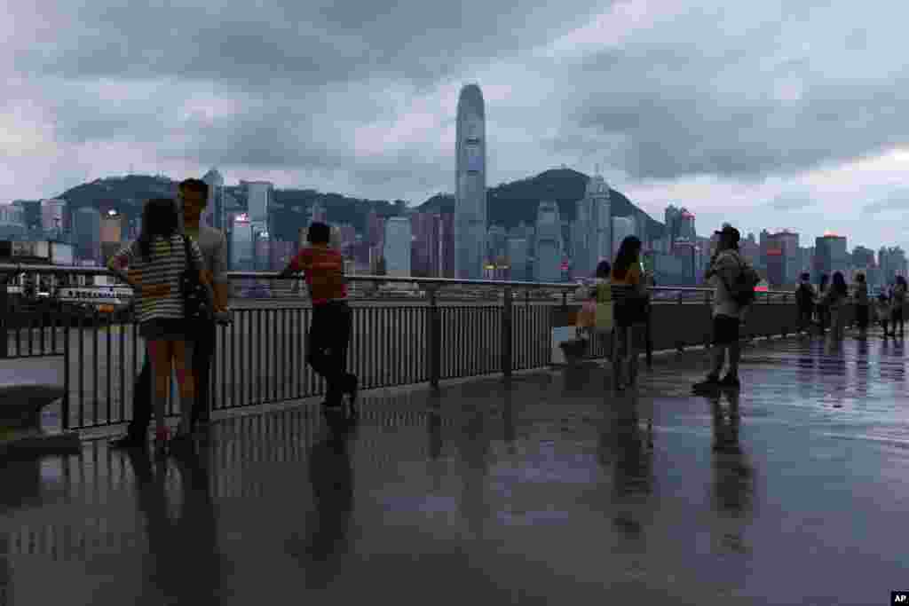 People gather at the waterfront of Hong Kong&#39;s Victoria Harbor, July 17, 2014.