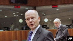 Britain's Foreign Secretary William Hague arrives at a European Union foreign ministers meeting at the EU Council headquarters in Brussels, December 1, 2011