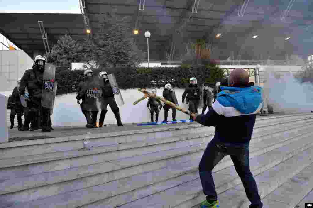 Farmers clash with Greek anti-riot police during a protest in Thessaloniki, against a controversial pension reform that is part of the country&#39;s tough economic bailout.