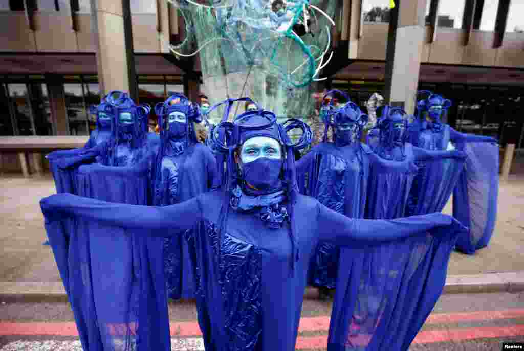 Members of the Ocean Rebellion group attend an Extinction Rebellion protest in London.